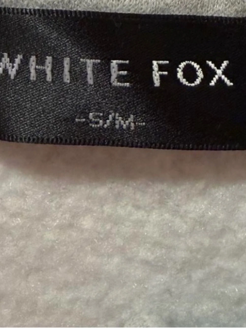 White Fox quarter zip sweater Size S/M fits up to a Large